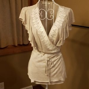 Super cute somewhat sheer wrap top